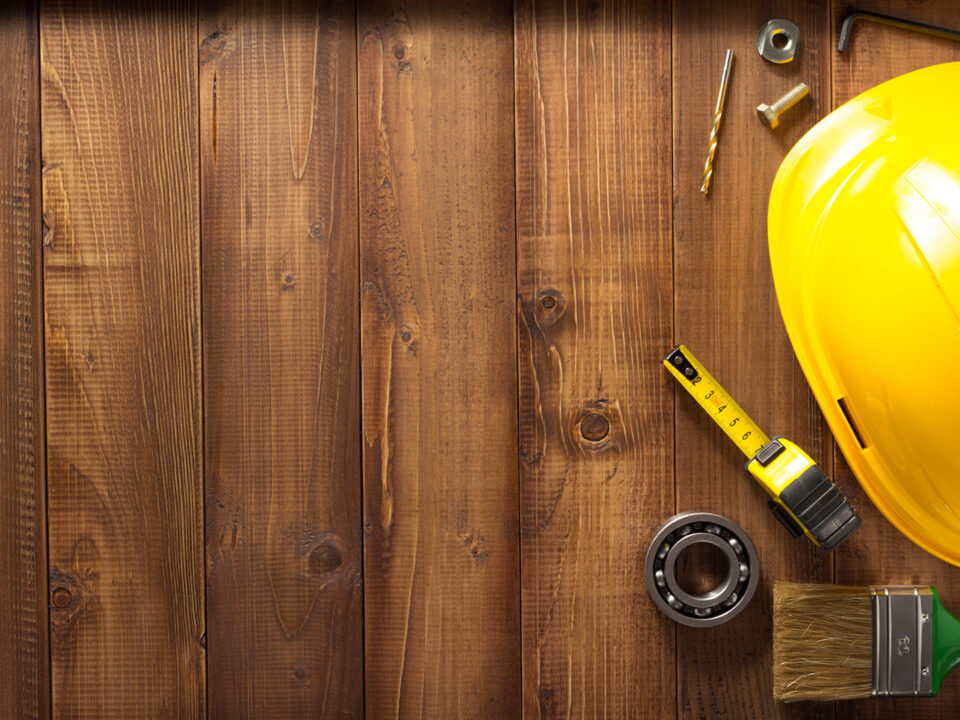 construction tools on a wood background